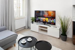 a living room with a large flat screen tv at Stylish Flat in Nusle by Prague Days in Prague
