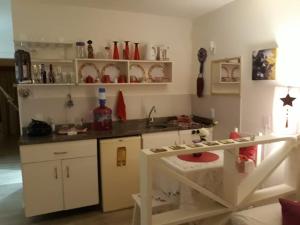 a kitchen with a play kitchen with a play table at Eco Paradise Cumbuco 131 in Cumbuco +10 photos