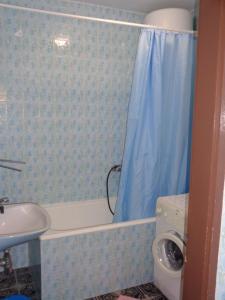 a bathroom with a tub and a sink and a shower at APARTMAN ZORAN MARUSIC in Marusici  +17 photos