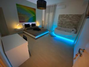 Postel nebo postele na pokoji v ubytování B&B La Perla & Suites