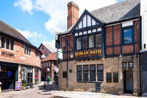 a street in an old town with buildings at The Roman Bath in York