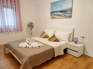 Posteľ alebo postele v izbe v ubytovaní Apartments Elin