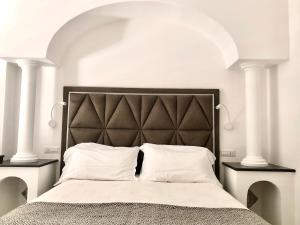 Postel nebo postele na pokoji v ubytování Hotel Reginella
