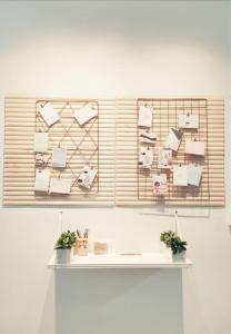 a room with a shelf with papers on a wall at Kepong Homestay by Warm Home in Kuala Lumpur