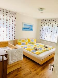 a bedroom with two dogs laying on a bed at Drei Zimmer Apartment am Rhein in Bad Säckingen