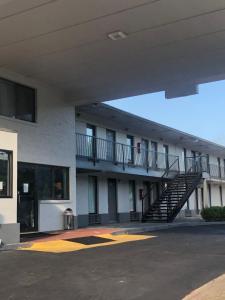 a building with a staircase in a parking lot at Travelodge by Wyndham Clarksville in Clarksville