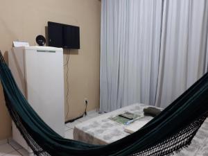 TV in/ali zabaviščno središče v nastanitvi Apartamento Temporada Amazonas