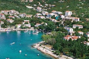 a view of a town with boats in the water at Lolo Apartment in Klenovica