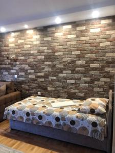 A bed or beds in a room at Apartments Bogdanović