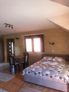 A bed or beds in a room at Apartments Bogdanović