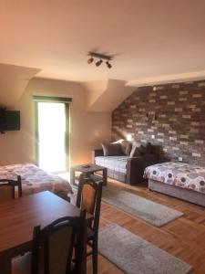 A bed or beds in a room at Apartments Bogdanović