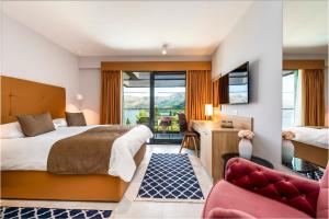 Postel nebo postele na pokoji v ubytování Hotel Seventh