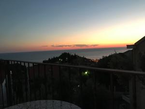 a sunset from the balcony of a house at REZEVICI BOUTIQUE VILLA in Petrovac na Moru