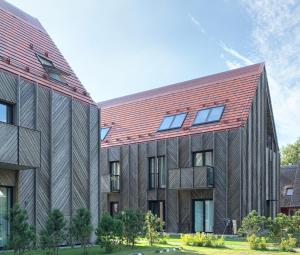 a rendering of a building with a red roof at Apartment KORA in Pervalka