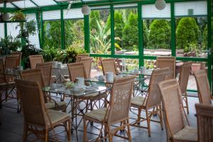 a group of tables and chairs in a patio at Hotel Landsberg in Landsberg