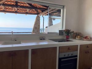 Kuchyňa alebo kuchynka v ubytovaní Boutique apartment with beach within walking distance, near Tropea