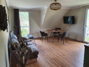 a living room with a couch and a table at Moselfeeling co2frei in Cochem