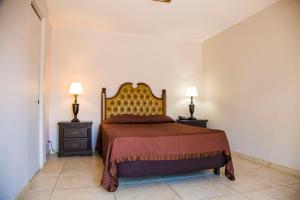 Uma cama ou camas num quarto em Hotel Cosmos Don Carlos