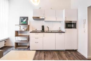 Kuchyň nebo kuchyňský kout v ubytování Central Apartments Aalen