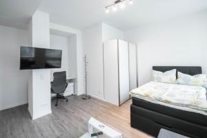 TV a/nebo společenská místnost v ubytování Central Apartments Aalen