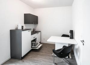 Kuchyň nebo kuchyňský kout v ubytování Central Apartments Aalen