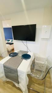 TV a/nebo společenská místnost v ubytování Neuf et cosy à Barr, route des vins
