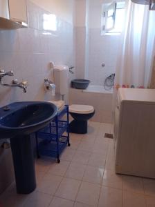 a bathroom with a sink and a toilet and a tub at Secluded Holiday Home Ivan in Kukljica