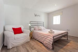 Łóżko lub łóżka w pokoju w obiekcie Apartamentos Jerez