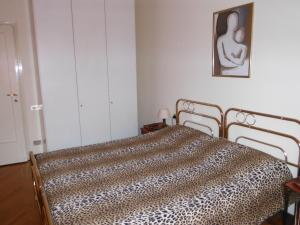 Postel nebo postele na pokoji v ubytování B&B Villa Olmo