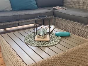 a coffee table with a small table at LunaSky Murter Mobile Home in Jezera