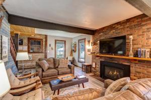 a living room filled with furniture and a fireplace at Fireside Inn in Breckenridge