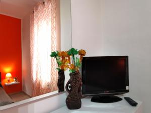 TV i/ili multimedijalni sistem u objektu Monteluce Apartment