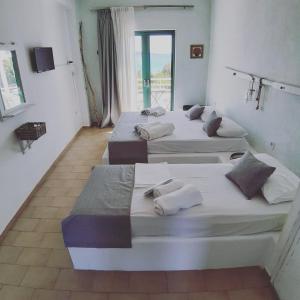 Postel nebo postele na pokoji v ubytování Filio Guesthouse