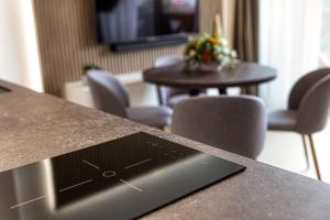 Televízia a/alebo spoločenská miestnosť v ubytovaní Apartment Tiliana