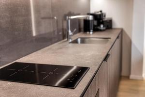 Kuchyňa alebo kuchynka v ubytovaní Apartment Tiliana