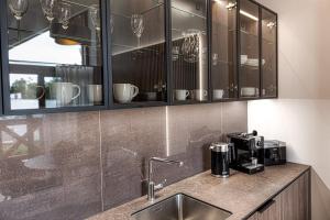 Kuchyňa alebo kuchynka v ubytovaní Apartment Tiliana
