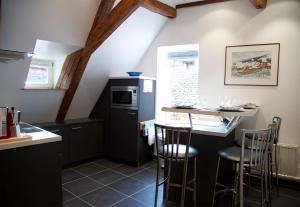A kitchen or kitchenette at Maison Rebleuthof
