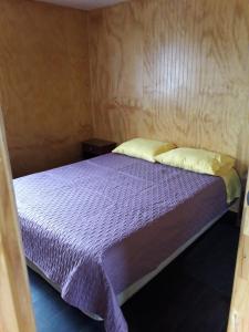 Cama o camas de una habitación en Cabaña Quinchen