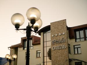 a street light in front of a building at Pride-Hotel in Berezniki