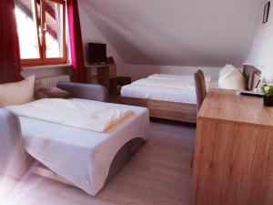 Postel nebo postele na pokoji v ubytování Hotel Oyer Hof - selbst Service