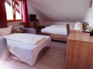 Katil atau katil-katil dalam bilik di Hotel Oyer Hof - selbst Service