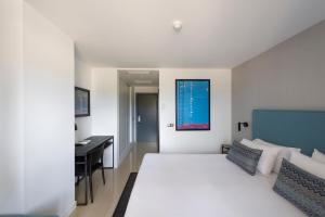 Postel nebo postele na pokoji v ubytování Hotel Tahiti