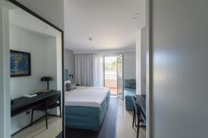 Postel nebo postele na pokoji v ubytování Hotel Tahiti