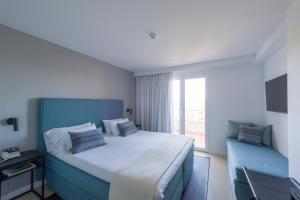 Postel nebo postele na pokoji v ubytování Hotel Tahiti