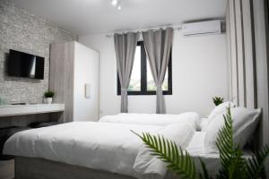 Ένα ή περισσότερα κρεβάτια σε δωμάτιο στο Apartmani Jović