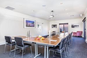 a conference room with a large table and chairs at Quest Sale in Sale