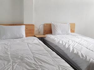 Ein Bett oder Betten in einem Zimmer der Unterkunft RedDoorz at Bypass Canggu