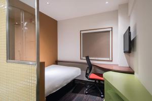 A bed or beds in a room at the b akasaka