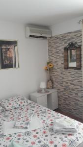 Postel nebo postele na pokoji v ubytování Apartmani Dačo