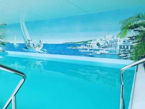 a swimming pool with a view of the ocean at Ringhotel Seehof in Berlin